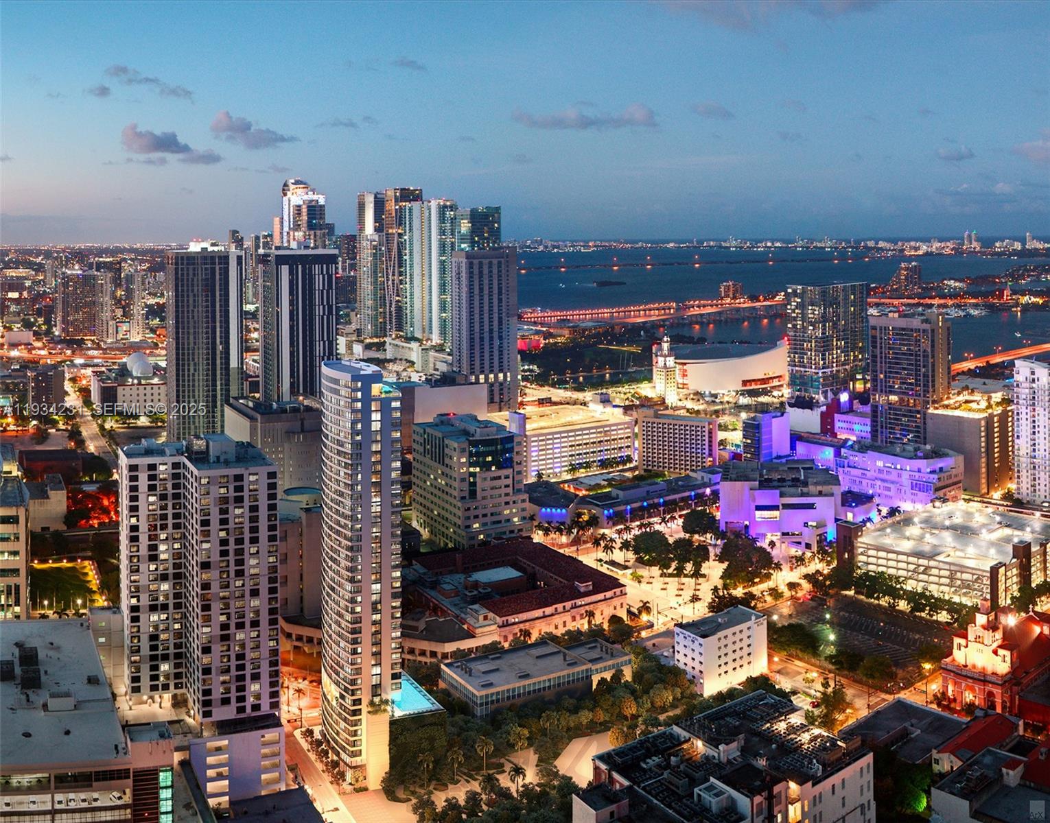 An aerial view of the Miami skyline at dusk featuring numerous high-rise buildings and bridges — 225 N Miami Ave # 1708, Miami FL 33128, MIAMI, FL