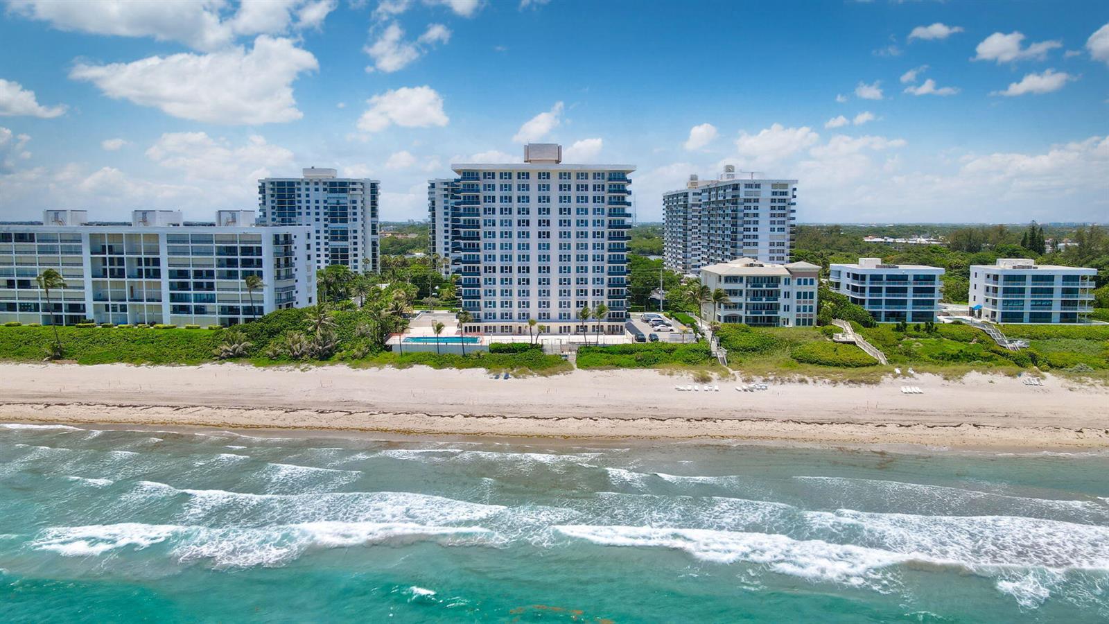 An aerial view of several beachfront apartment buildings along a sandy coastline with ocean waves — 2066 N Ocean Boulevard, Boca Raton FL 33431, BOCA RATON, FL