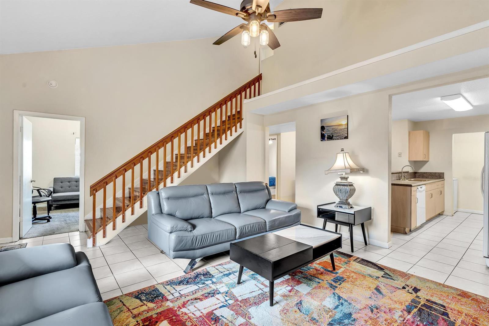 A collage shows a swimming pool, a residential building exterior, and two living room interiors — 10240 NW 33rd Place, Sunrise FL 33351, SUNRISE, FL