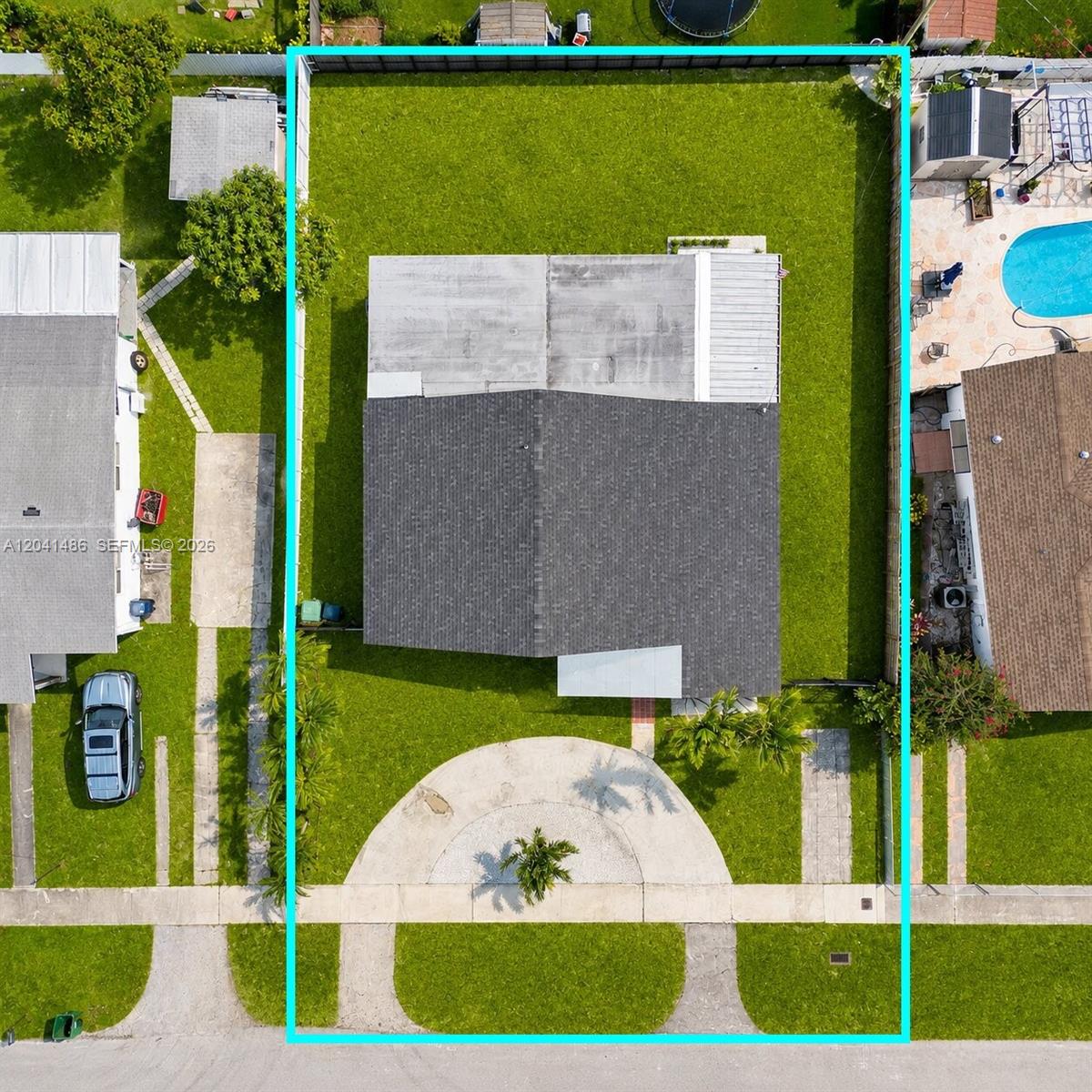 An aerial view shows a house with a circular driveway and a fenced backyard — 12370 SW 190th Ter, Miami FL 33177, MIAMI, FL