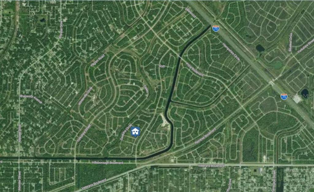 This is an aerial map showing a residential neighborhood with a house icon marking a property — Lot 9 MORRISETTE LANE, NORTH PORT, FL