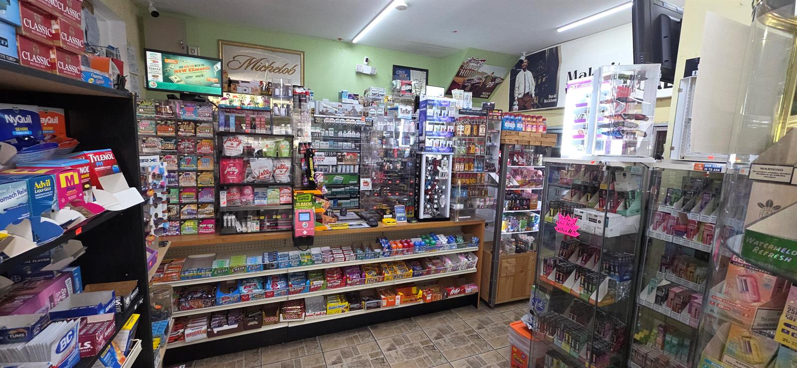This retail store interior features shelves stocked with various snacks, medications, and tobacco products — 580 S Federal Highway, Pompano Beach FL 33062, POMPANO BEACH, FL