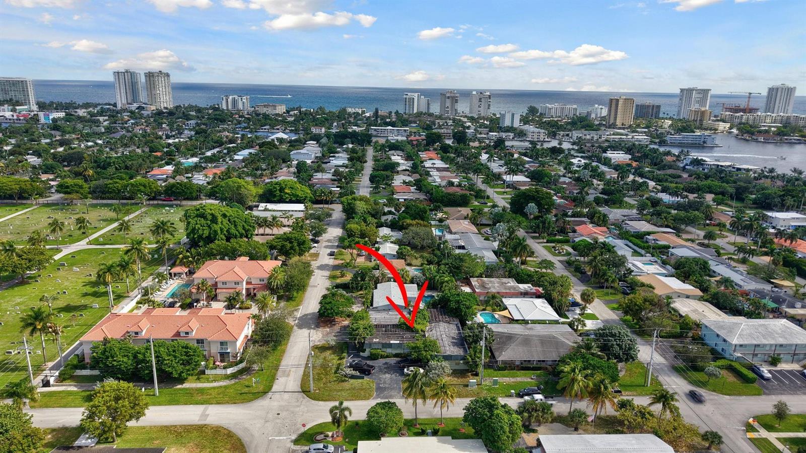An aerial view shows a residential property with a red arrow pointing to the roof — 500 SE 23rd Avenue, Pompano Beach FL 33062, POMPANO BEACH, FL