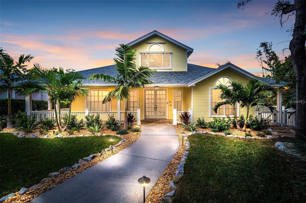 An aerial view shows a house with a shingled roof, pool, and surrounding landscaping — 266 FLORIDA BOULEVARD, CRYSTAL BEACH, FL