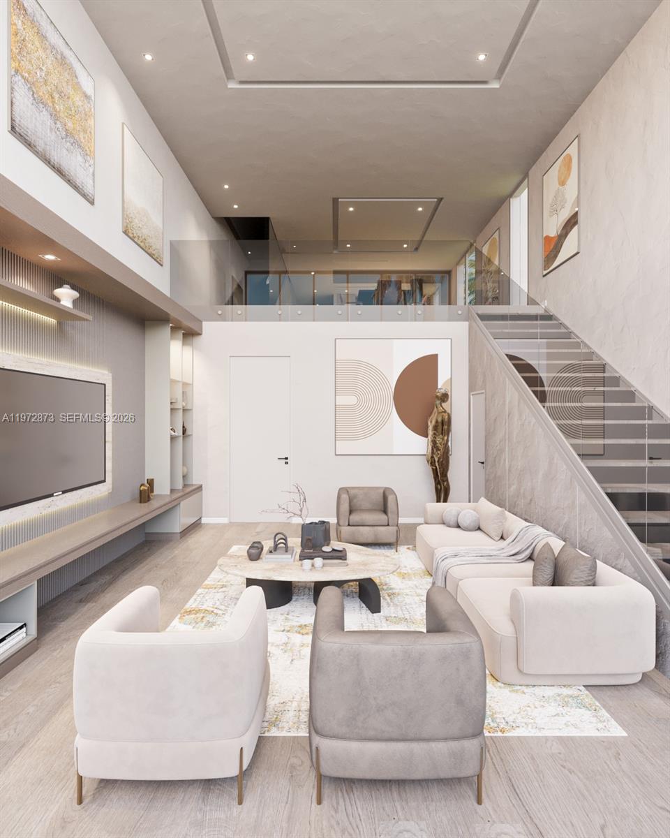 A modern dining room features a white oval table, leather chairs, and large windows — 420 NE 62nd St, Miami FL 33138, MIAMI, FL