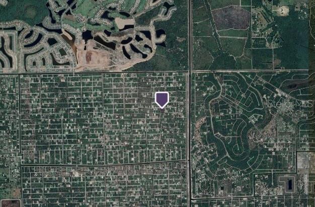 This is an aerial map showing a property location marked with a purple pin — 2605 69TH STREET W, LEHIGH ACRES, FL