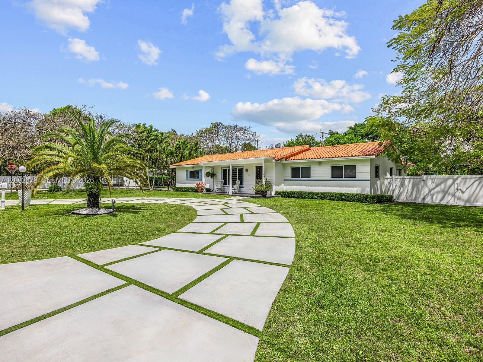 A single-story house with a red tile roof and a curved concrete paver driveway — 7495 SW 73rd Ter, Miami FL 33143, MIAMI, FL