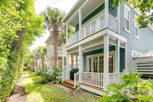 A two-story house with blue siding, white railings, and a porch overlooking a grassy yard — 102 Anglers Way, Islamorada FL 33036, ISLAMORADA, FL