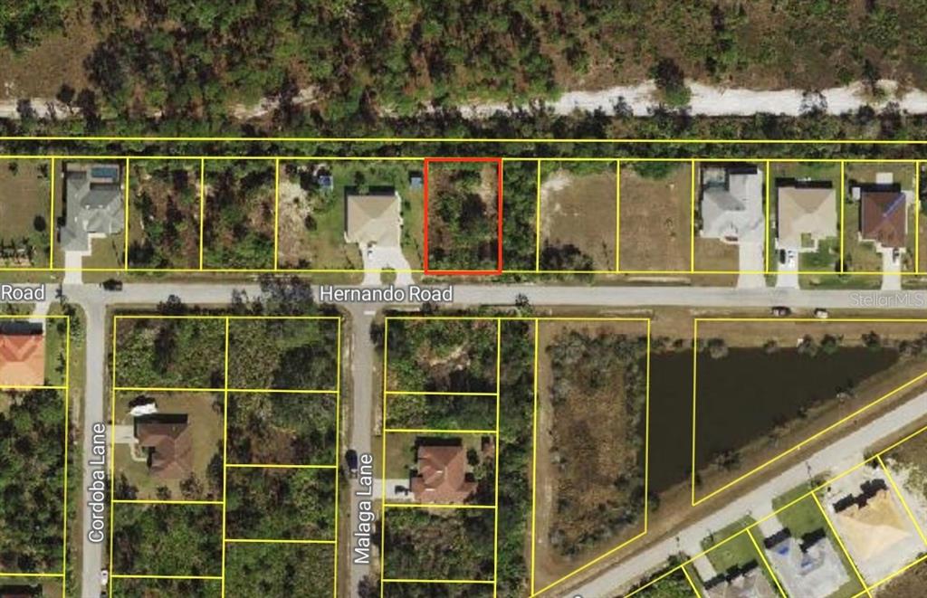 This is an aerial map showing a vacant residential lot outlined in red on a street — Lots 35 & 36 HERNANDO ROAD, NORTH PORT, FL