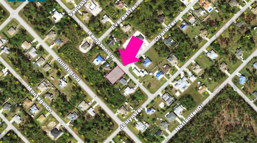 This is an aerial map showing a vacant residential lot highlighted by a pink arrow — 5533 KEMPSON LANE, PORT CHARLOTTE, FL