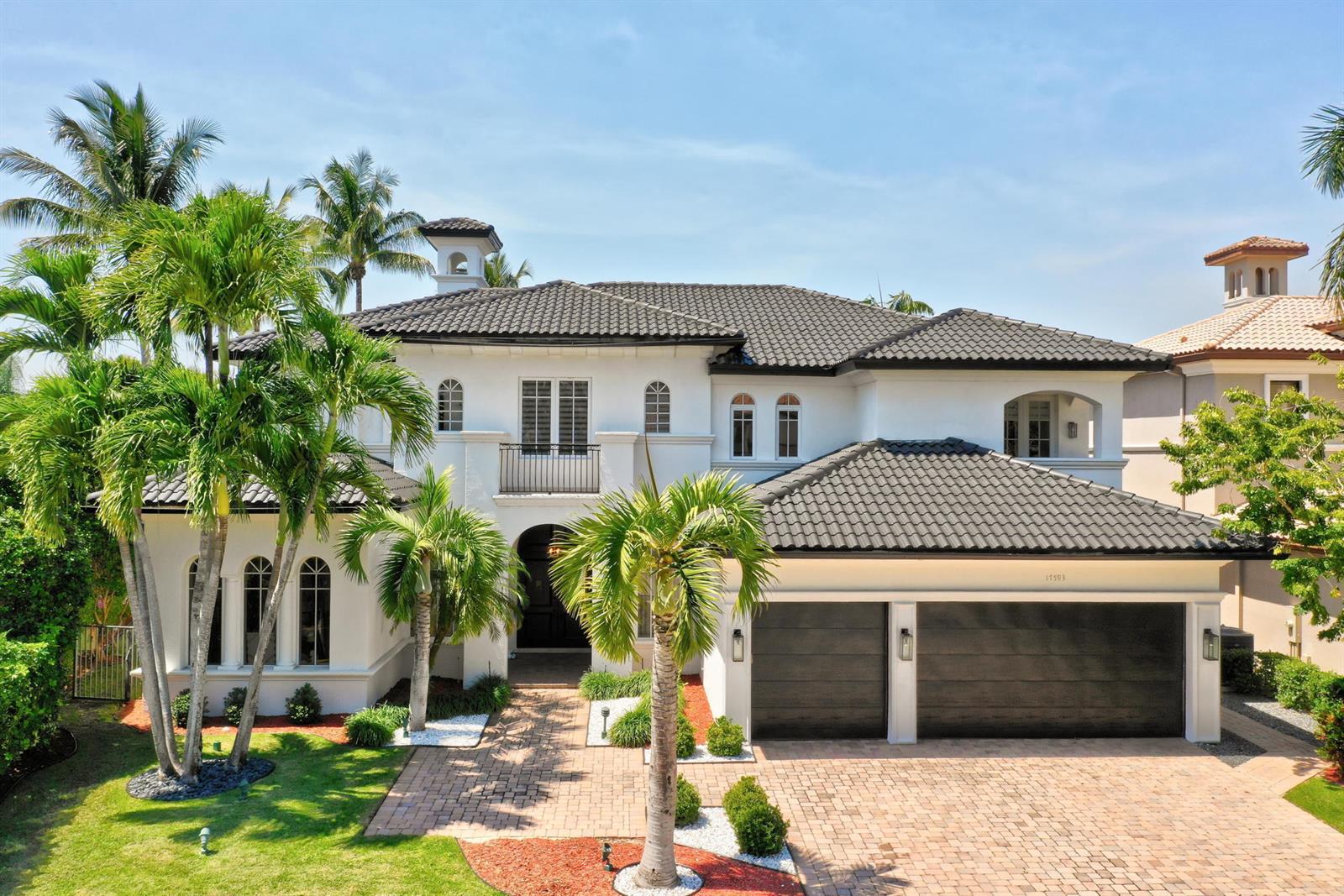 A two-story white stucco house with a dark tile roof and a three-car garage — 17593 Middle Lake Drive, Boca Raton FL 33496, BOCA RATON, FL