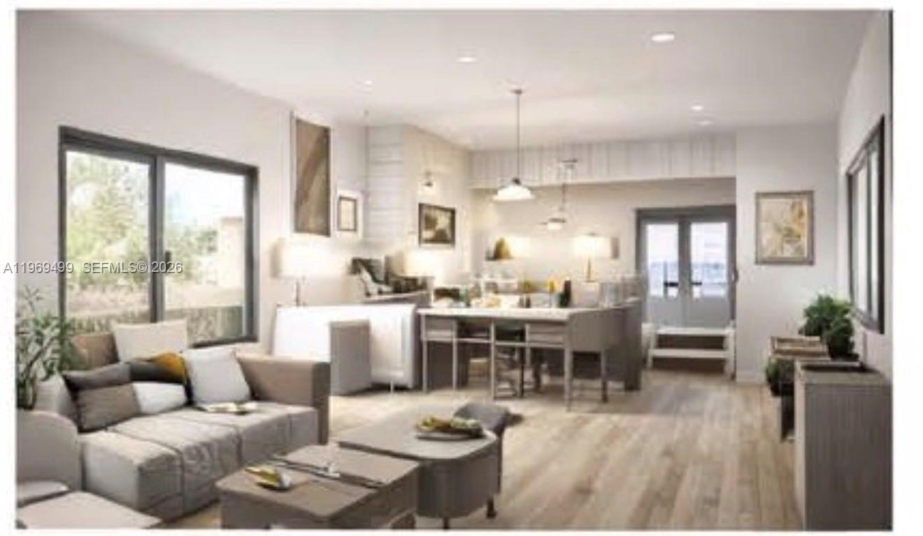 This rendering shows an open-concept living and dining area with light wood flooring — 2600 NW 23rd Ave, Miami FL 33142, MIAMI, FL