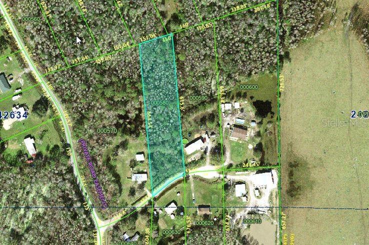 This is a property map showing a highlighted rectangular parcel of land with surrounding lots — 0 CHISHOLM TRAIL, POLK CITY, FL