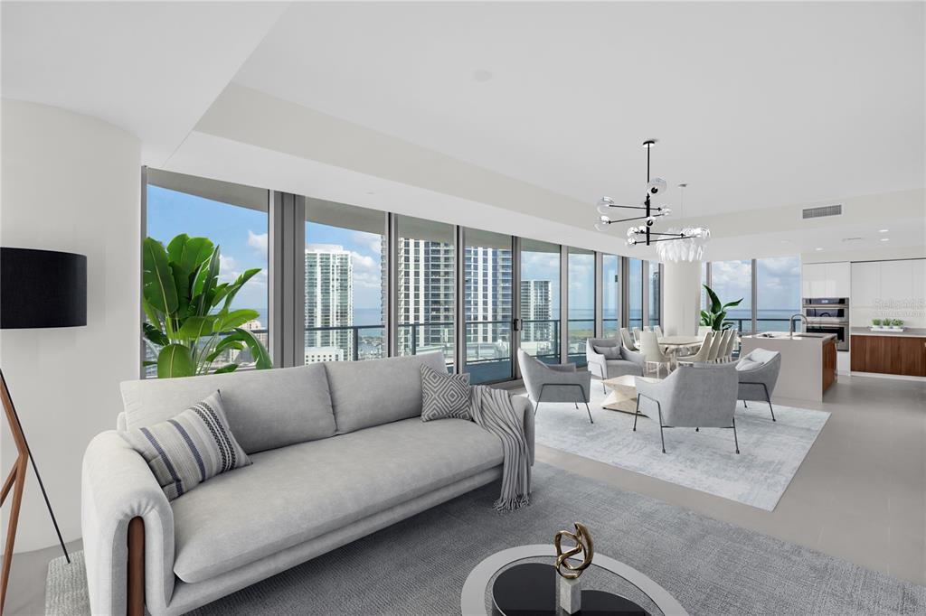A modern open-concept living and dining area features floor-to-ceiling windows with expansive city and water views — 400 CENTRAL AVENUE UNIT 2207, ST PETERSBURG, FL