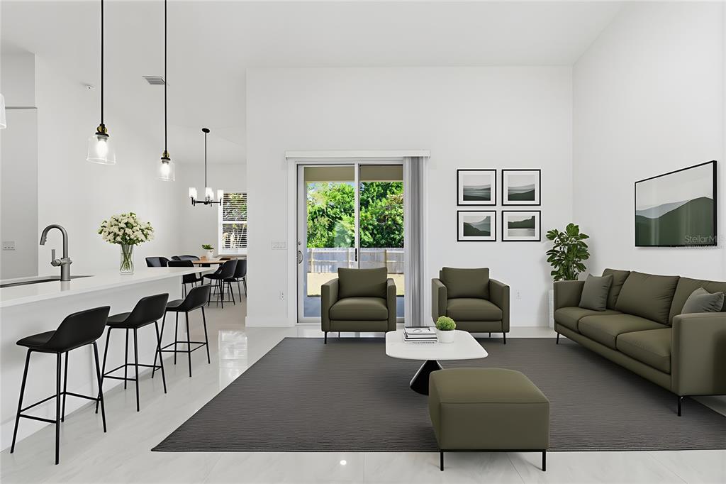 This is a virtual rendering of an open-concept living room and kitchen with modern furnishings — 1466 DEWITT STREET, PORT CHARLOTTE, FL