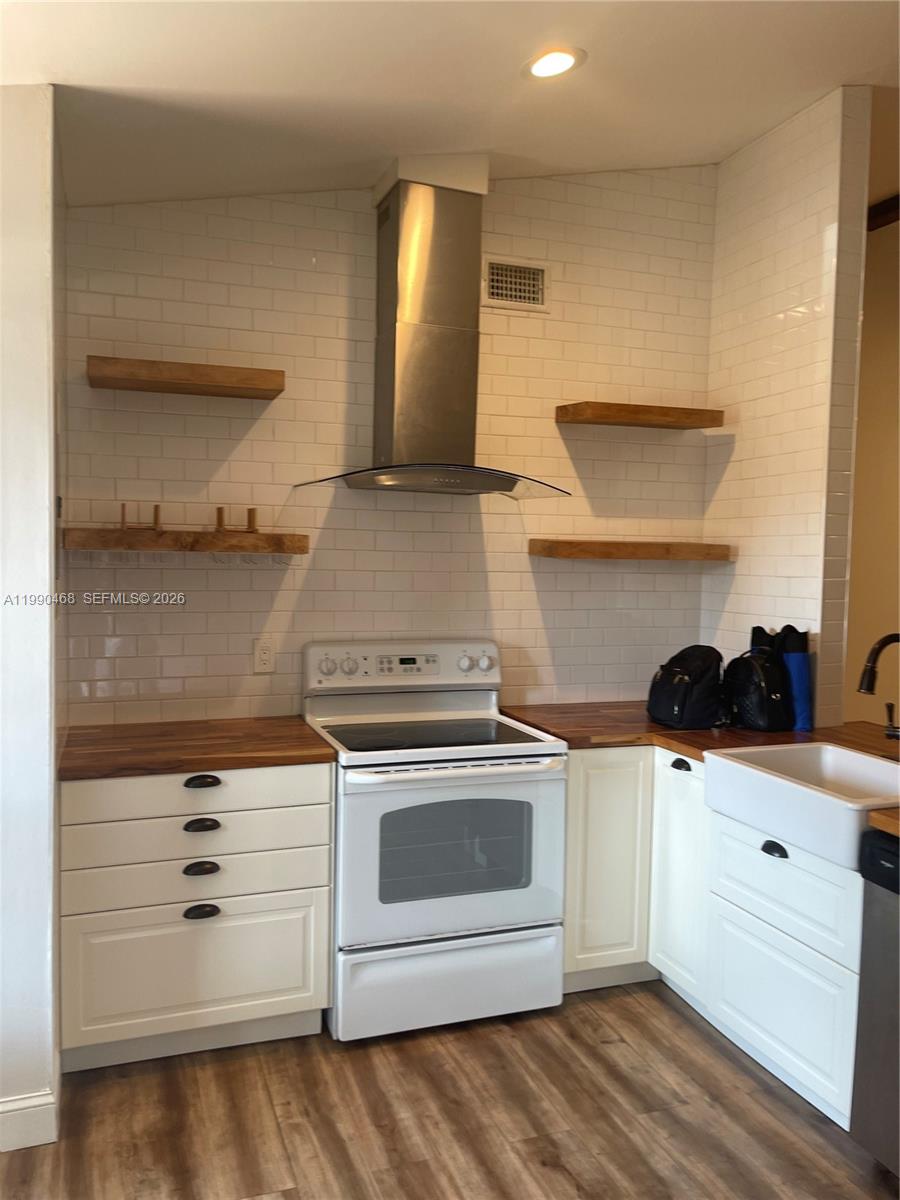 A kitchen features white subway tile, wood countertops, open shelving, and a stainless steel hood — 11269 SW 116th Ter # 11269, Miami FL 33176, MIAMI, FL