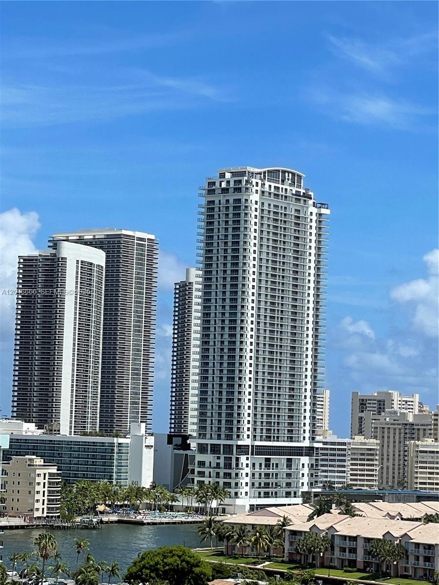 A view of several tall residential high-rise buildings situated along a waterfront — 2500 PARKVIEW DR # 1405, Hallandale Beach FL 33009, HALLANDALE BEACH, FL