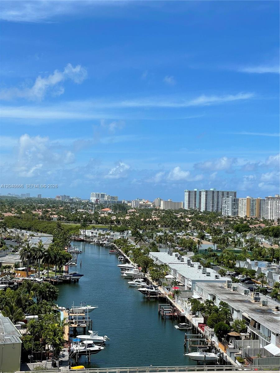 An elevated view shows a canal lined with boats and residential buildings under a blue sky — 2500 PARKVIEW DR # 1405, Hallandale Beach FL 33009, HALLANDALE BEACH, FL