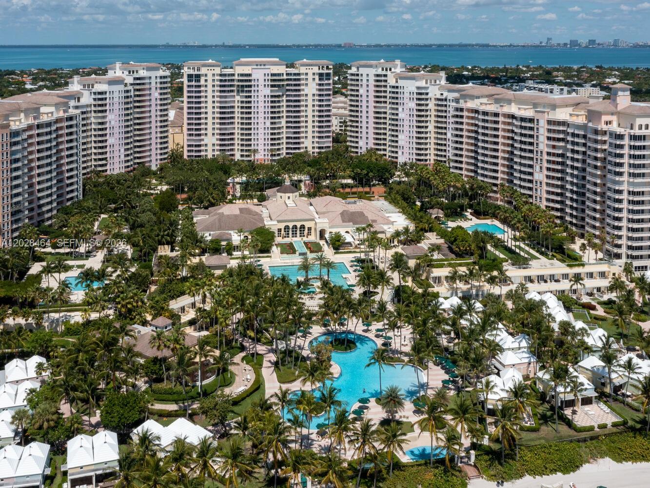 An aerial view shows a large residential complex with multiple high-rise buildings and swimming pools — 781 Crandon Blvd # 405, Key Biscayne FL 33149, KEY BISCAYNE, FL