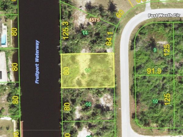 This map shows a rectangular waterfront lot highlighted in yellow along a canal — 14238 FORT WORTH CIRCLE, PORT CHARLOTTE, FL