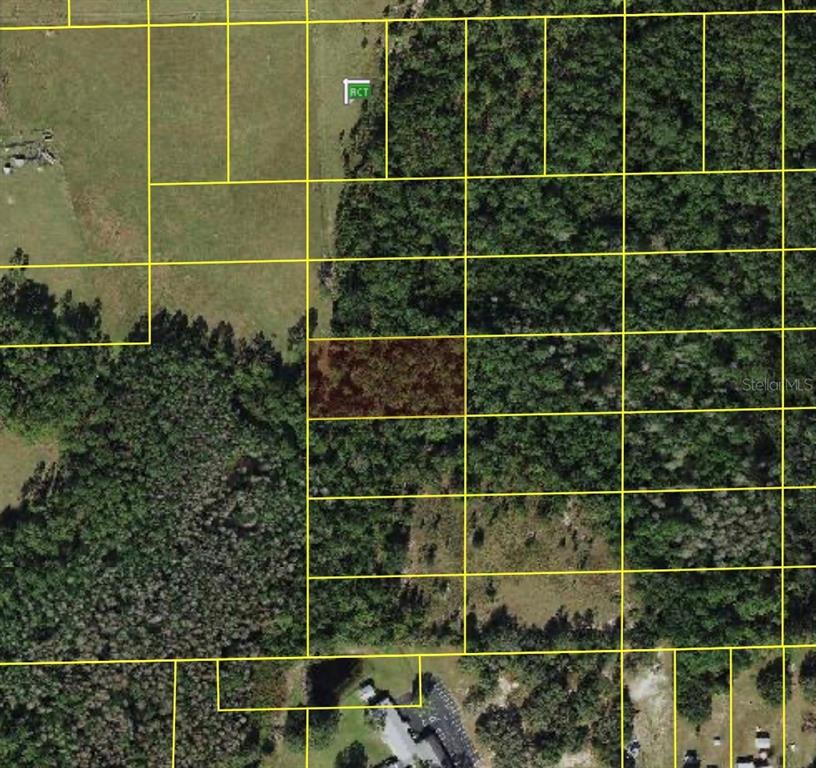 This is an aerial map view showing a highlighted rectangular parcel of land — POLK CITY, POLK CITY, FL
