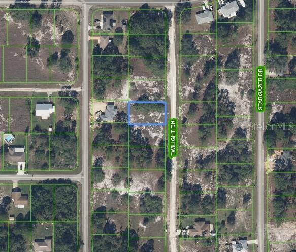 This is an aerial map showing a vacant residential lot highlighted in blue on Twilight Drive — 648 TWILIGHT DRIVE, LAKE PLACID, FL