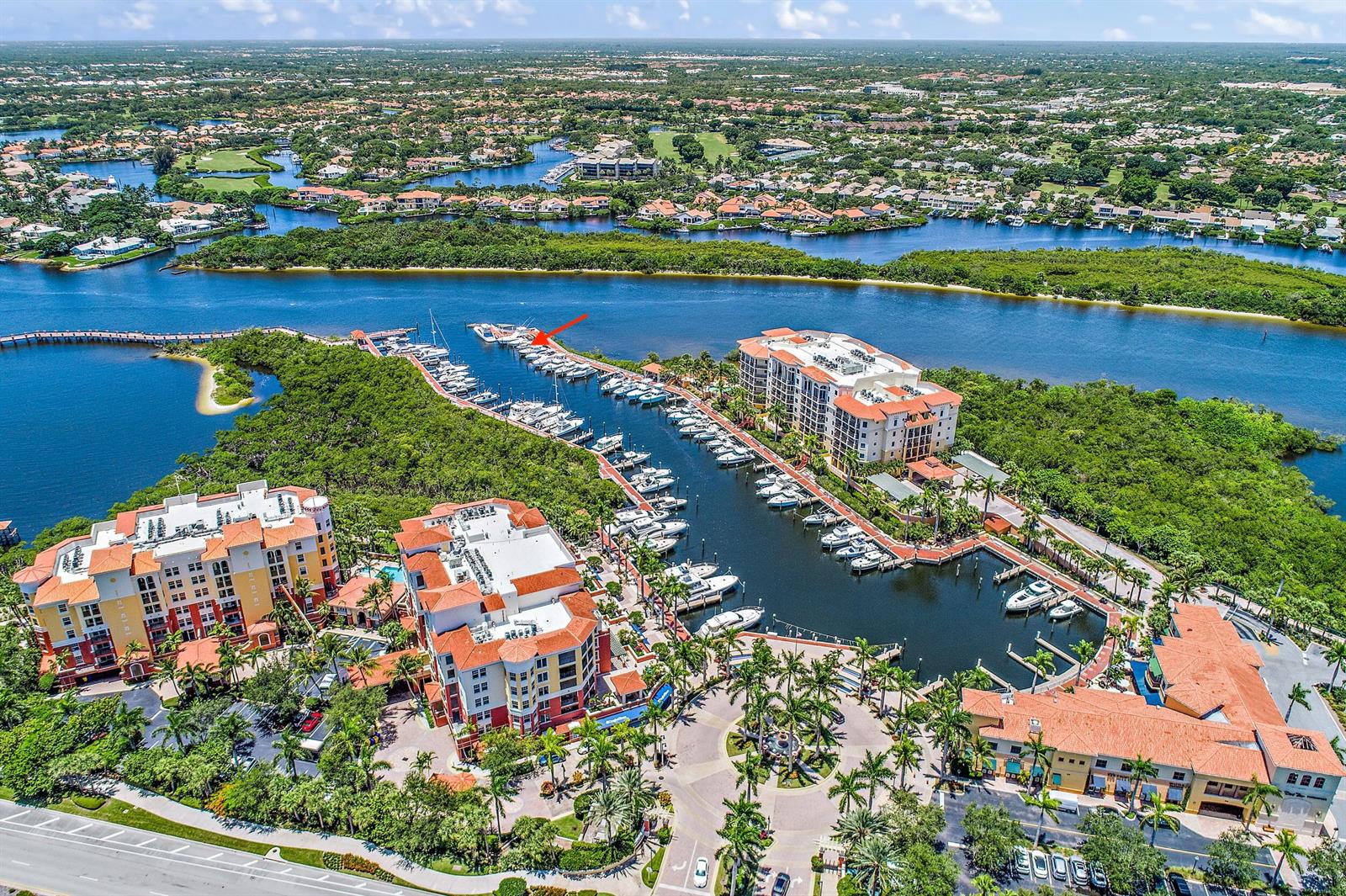 An aerial view shows a waterfront condominium complex with a private marina and boat slips — 348 S Us Highway 1, Jupiter FL 33477, JUPITER, FL