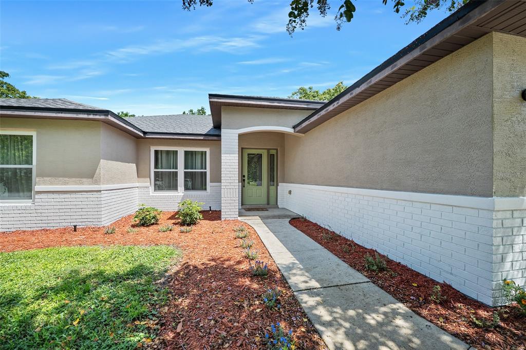981 LAUREL OAKS LANE, ORANGE CITY, FL — photo 2 of 26