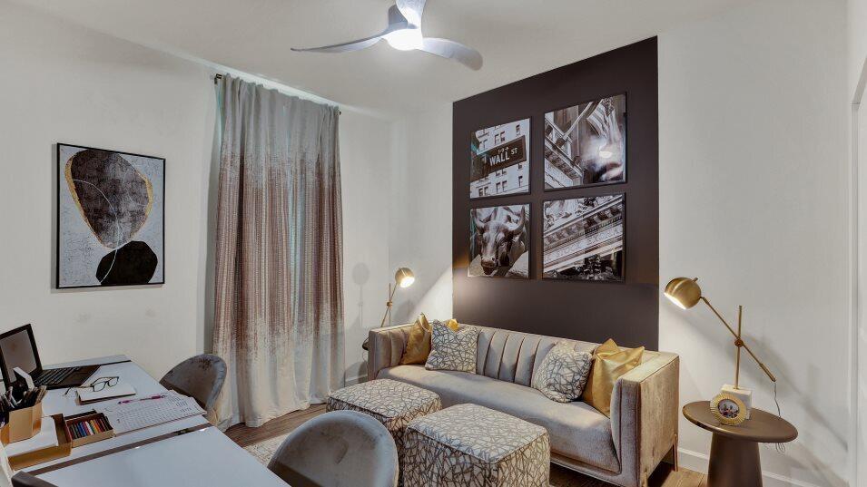 A home office features a desk, a sofa with two ottomans, and wall art — 1699 Pelican Post Place, FL 33470, FL