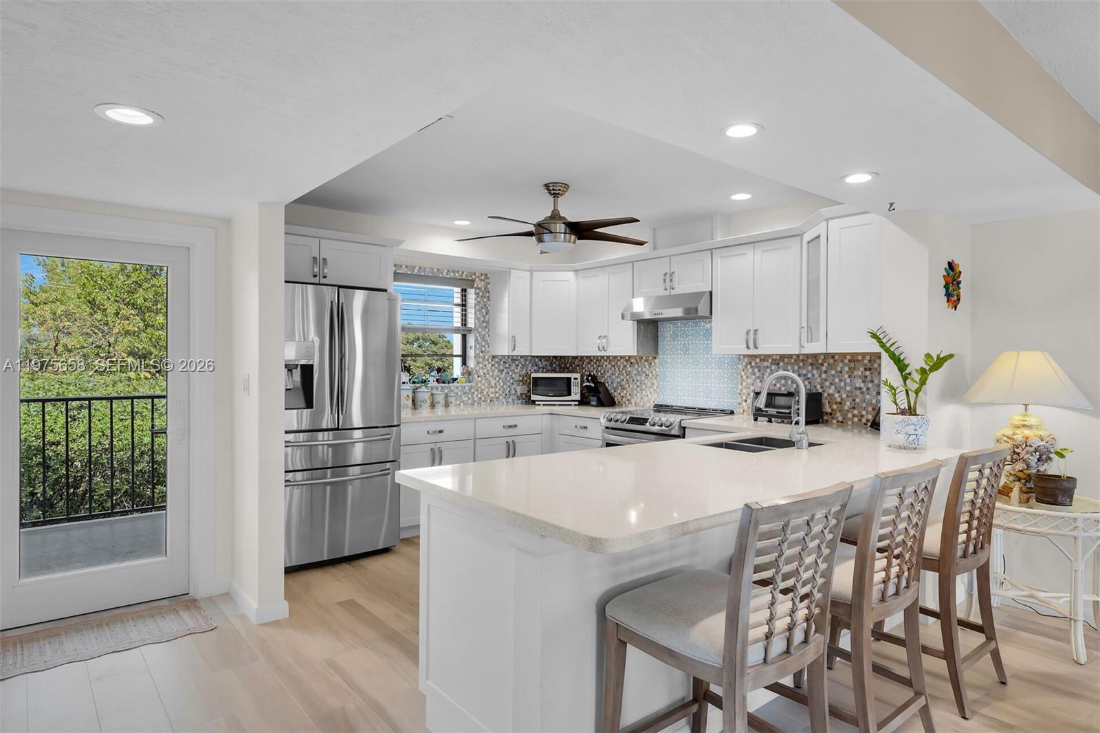 Kitchen with bar seating — ISLAMORADA, FL