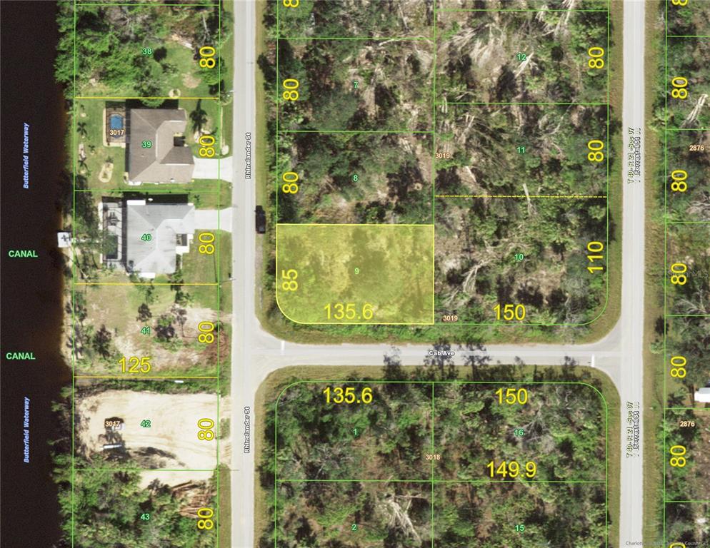 This is a property map showing vacant residential lots along a canal and streets — 1086 RHINELANDER STREET, PORT CHARLOTTE, FL
