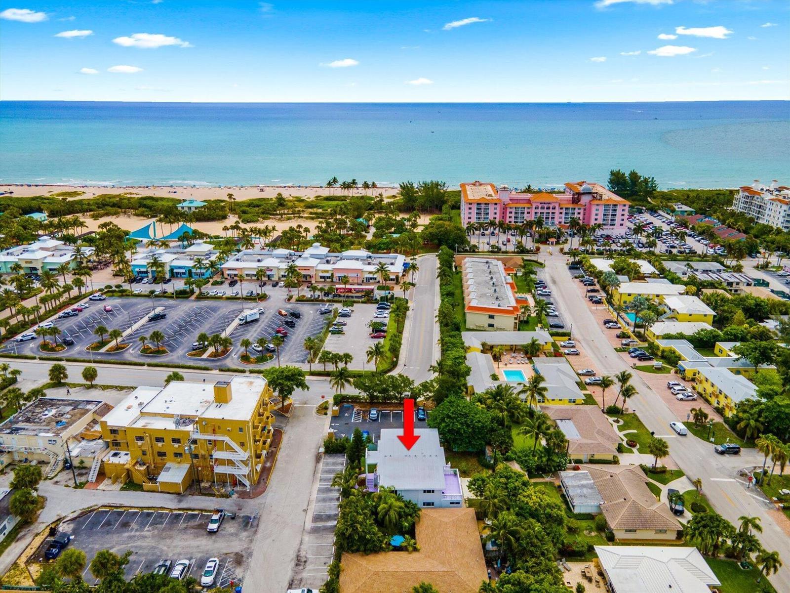 An aerial view shows a multi-story building with a red arrow pointing to its roof — 1279 Beach Road # 3, West Palm Beach FL 33404, WEST PALM BEACH, FL