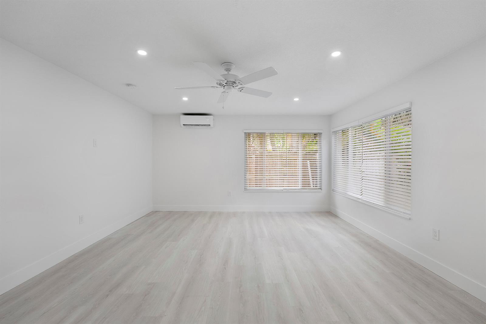 An empty room with white walls, light wood-look flooring, a ceiling fan, and window blinds — 1279 Beach Road # 3, West Palm Beach FL 33404, WEST PALM BEACH, FL