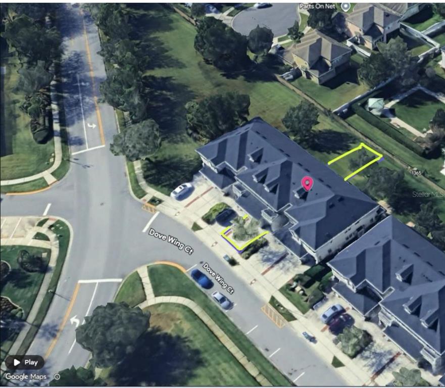 An aerial view shows a townhouse complex with highlighted property boundaries on Dove Wing Court — 13942 DOVE WING COURT, ORLANDO, FL