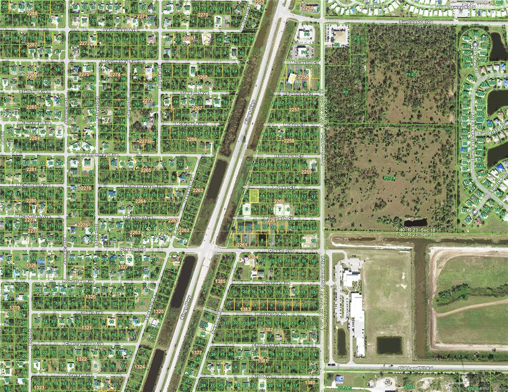 This is an aerial map showing a residential neighborhood grid divided by a highway — 23467 MOSES COURT, PORT CHARLOTTE, FL