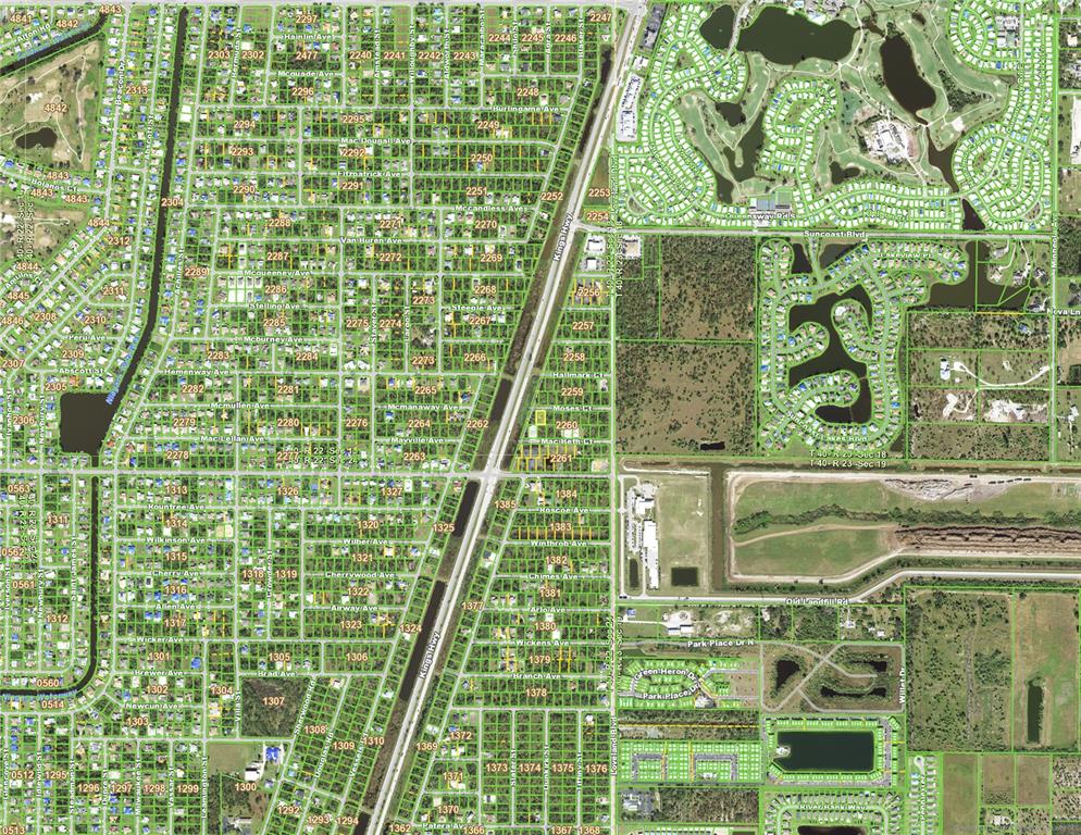 This is an aerial map showing a residential neighborhood divided by a major highway — 23467 MOSES COURT, PORT CHARLOTTE, FL