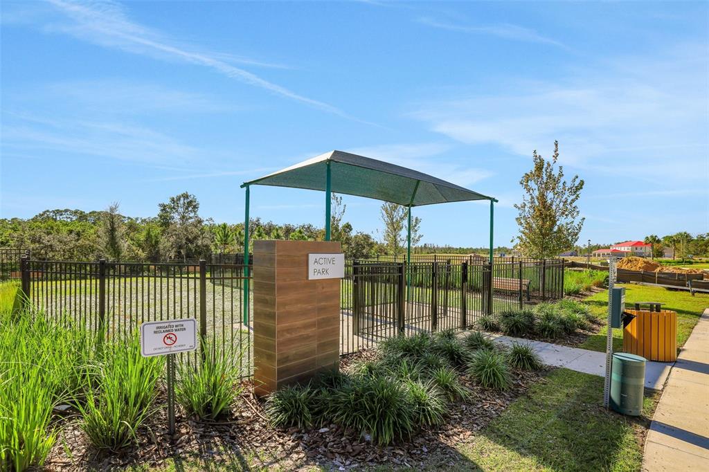 A two-story house with light-colored siding, a blue front door, and a covered porch — 13019 SERENE GLADE ROAD, WINTER GARDEN, FL