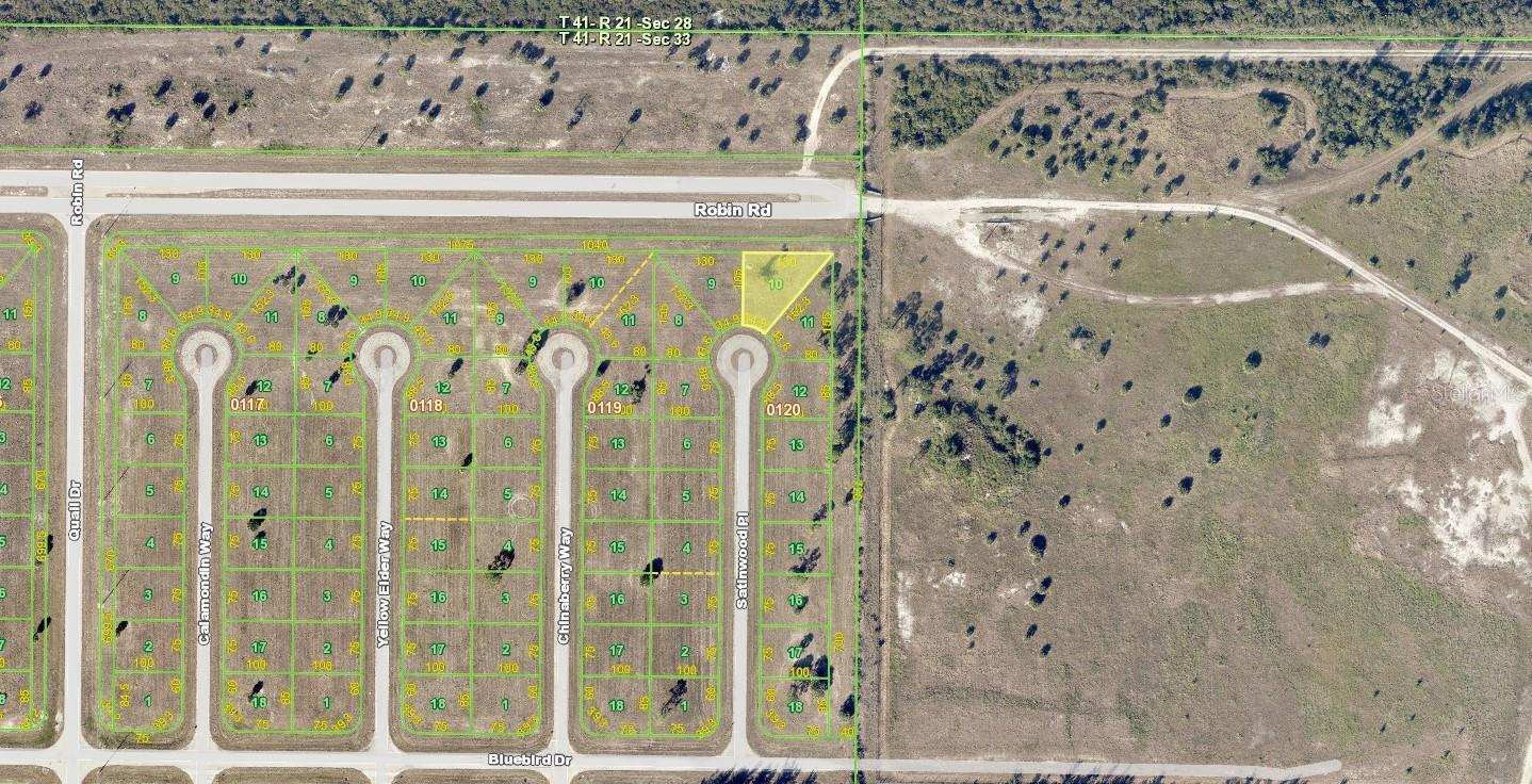 This is an aerial map showing a residential subdivision with vacant lots and paved streets — 18 Satinwood Place, FL 33946, FL
