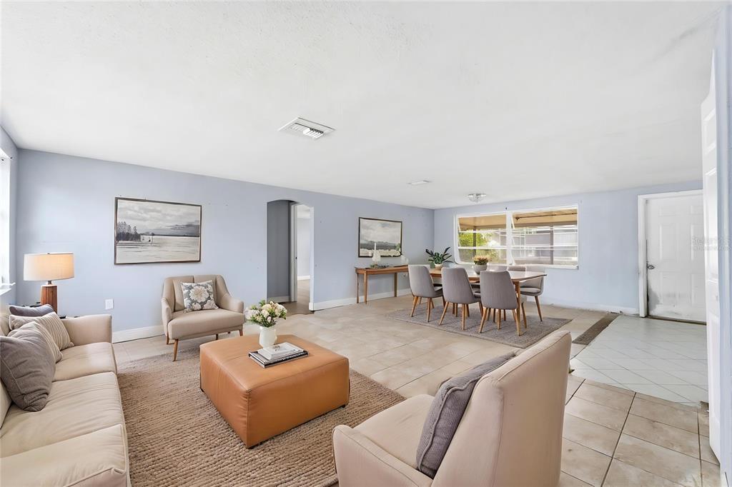 A single-story house with a light blue exterior, a palm tree, and a garage — 9720 RAINBOW LANE, PORT RICHEY, FL