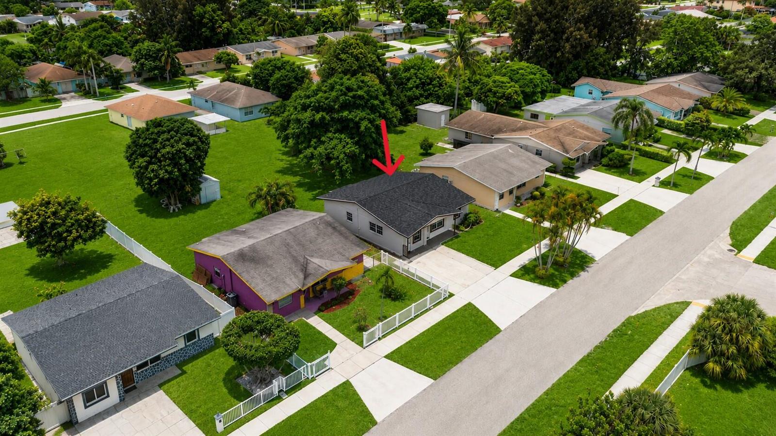 An aerial view shows a residential neighborhood with a gray-roofed house marked by a red arrow — 417 SW 8th Avenue, Delray Beach FL 33444, DELRAY BEACH, FL