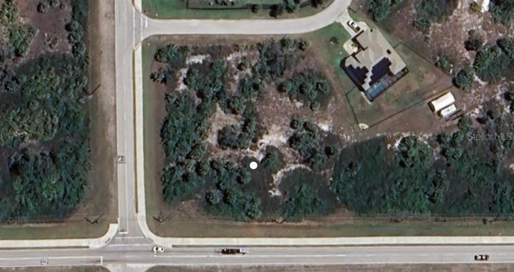This aerial map view shows a vacant, wooded residential lot located at a street corner — 13996 APPLETON BOULEVARD, PORT CHARLOTTE, FL