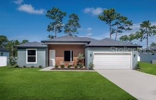 A single-story house with a gray exterior, a two-car garage, and a front lawn — 8903 SW 135TH ST, OCALA, FL