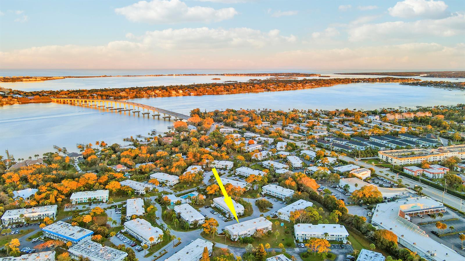 An aerial view shows a residential complex with a yellow arrow pointing to a building — 2929 SE Ocean Boulevard # 2, Stuart FL 34996, STUART, FL