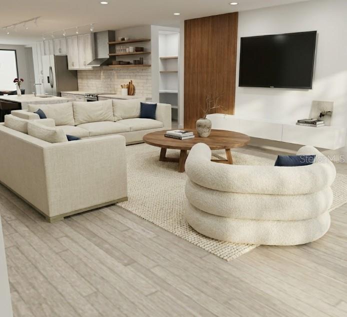 This rendering shows an open-concept living room with a sectional sofa and a curved chair — 2408 JAMAICA AVENUE SW, PALM BAY, FL
