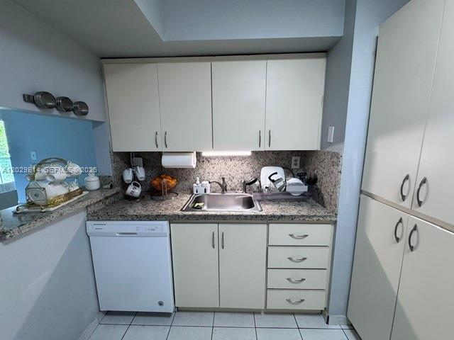 A kitchen features white cabinets, a stainless steel sink, a dishwasher, and speckled countertops — 11780 SW 18th St # 2, Miami FL 33175, MIAMI, FL