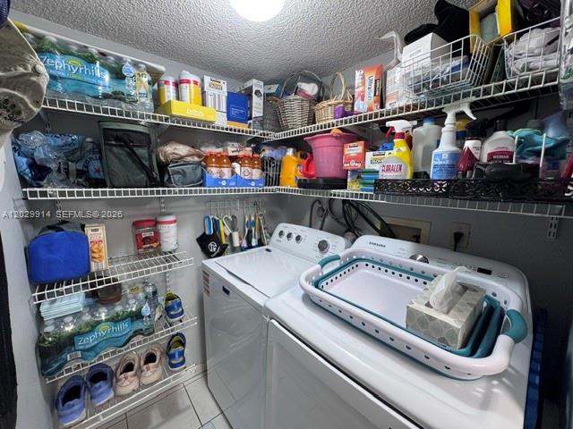 A laundry room features wire shelving stocked with household supplies above a washer and dryer — 11780 SW 18th St # 2, Miami FL 33175, MIAMI, FL