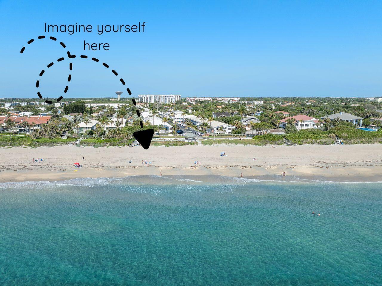 An aerial view shows a sandy beach, turquoise ocean, and coastal residential buildings — 5505 N Ocean Boulevard # 204, Ocean Ridge FL 33435, OCEAN RIDGE, FL