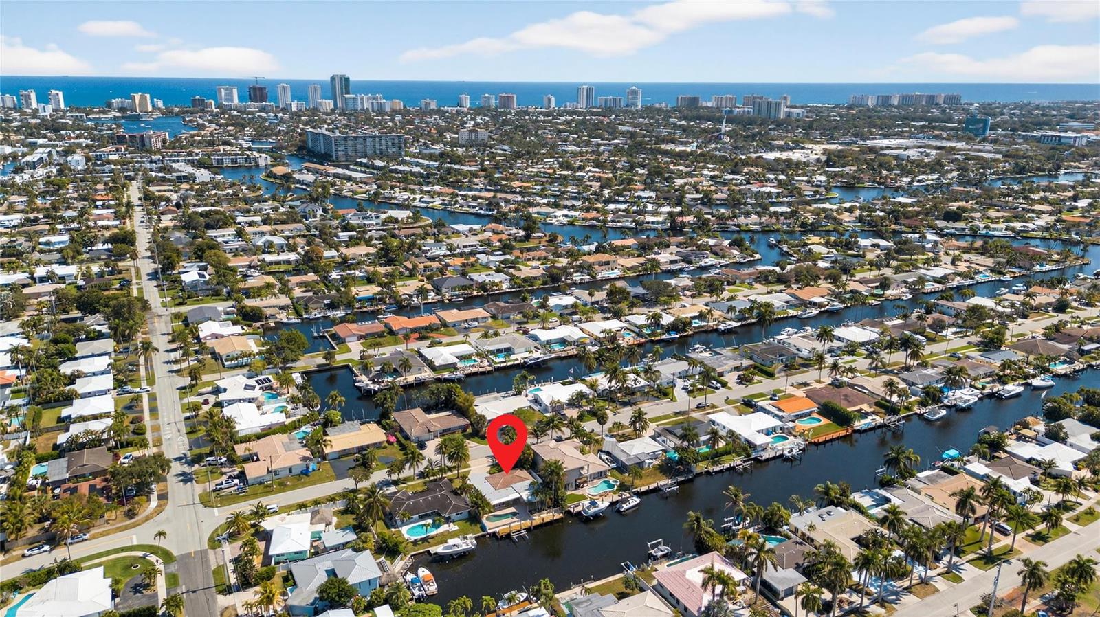 An aerial view shows a waterfront residential neighborhood with a red pin marking a house — 601 SE 5th Terrace, Pompano Beach FL 33060, POMPANO BEACH, FL