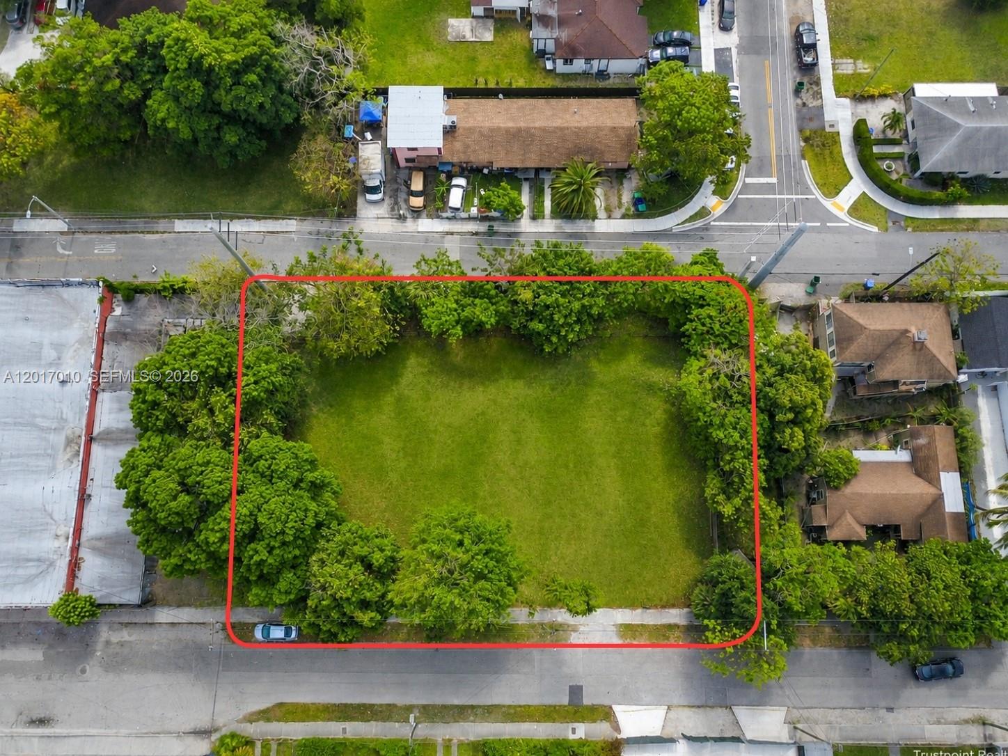 An aerial view shows a rectangular vacant lot surrounded by trees and residential buildings — 3509 NW 9th Ave, Miami FL 33127, MIAMI, FL