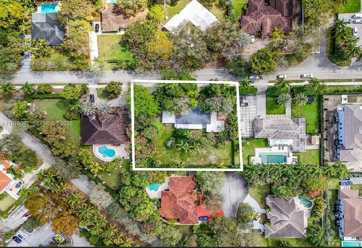 An aerial view shows a single-story house with a large backyard surrounded by mature trees — 9330 SW 72nd Ave, Pinecrest FL 33156, PINECREST, FL